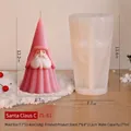 Detail van de siliconen mal voor kerstman met afgewerkte roze dwergkaars op houten tafel - Kerstman C