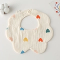 Detail of petal-shaped cotton gauze baby bib with colorful heart prints and soft texture - Gauze Flower Scarf - Beige Base With Heart Shape
