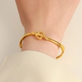 Gothic gold snake bracelet with detailed scale texture on model wrist with hinge clasp - Hinged Bracelet / Gold Snake Style (6661)
