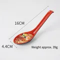 Realistic ramen noodle food model in a red and black decorative spoon, weight 39g - Pork Belly Noodles-Red Spoon
