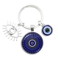 Blue evil eye keychain featuring mandala glass pendant and silver eye charm on white background - Blue Mandala Eye (5)