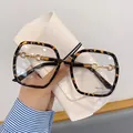 Occhiali anti-luce blu tartarugati con dettaglio morsetto dorato sulle stanghette - Tortoise