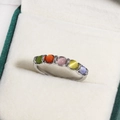 Silver ring featuring five colorful round cat-eye stones on a white velvet display - Five-Color Round Cat's Eye Colorful Row Diamonds Style (白金色16)
