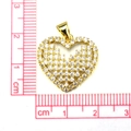 Golden heart pendant with micro-pave zircons shown next to a ruler for size reference - #10 Pave Heart