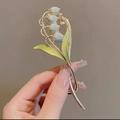 Elegant lily of the valley hair clip with green leaves and light blue flower buds - Light Blue Lily of the Valley Hair Clip