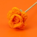 Detail of handcrafted orange crochet rose flower made of premium knit wool yarn - Orange