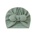 Detail of light green knitted baby turban hat with a large decorative bow on front - Suitable for 0-18 Months / Cyan Green