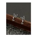 Detailed macro of silver butterfly enamel earrings on a professional dark display stand - Black Butterfly Pendant Style (EH0026)