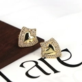 Detailed close-up of gold heart stud earrings with sparkling cubic zirconia pavé setting - Style 5