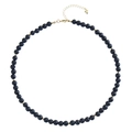 Detailed macro view of black volcanic stone beads with gold spacers and heart charm clasp - Lava Stone Necklace