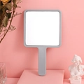 Sleek gray square hand mirror on pink pedestal with elegant aesthetic background - Gray