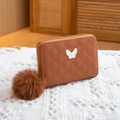 Brown quilted leather purse with white butterfly charm and fluffy pom-pom keychain - Brown