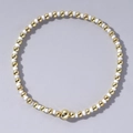 Handmade bohemian beaded bracelet featuring alternating white and gold round beads - White and Gold