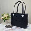 Detail of mini black EVA perforated tote bag with white buttons on a clean studio background - Small / Black