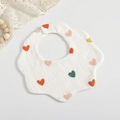 Soft muslin cotton baby bib with colorful heart patterns and snap closure on white background - Colorful Heart
