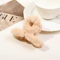 Beige faux fur plush hair claw clip with cross twist design on a fashion magazine - 9cm Plush Cross - Light Khaki