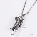 Detail view of silver astronaut pendant showing 45mm height and 55g weight specifications - Vintage Astronaut Style (5)