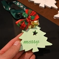 Green Christmas tree scented plaster hanging ornament with golden bell and plaid bow - Bluebell