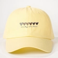 Pale yellow cotton baseball cap with gradient hearts and one day at a time text - One Size / Goose Yellow