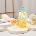 Creative liquid quicksand milk bottle keychain with yellow stars and pink strap - Silicone Strap Sippy Cup Style / Yellow Orange