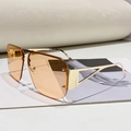 Lunettes aviateur tendance avec branches dorées ajourées et verres orange dégradé - Monture Dorée Verres Marron Transparent