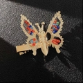 Elegant gold butterfly hair clip with colorful beads on a premium black surface - Colored Beads Style (F0001) / Gold