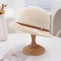 Breathable woven linen bucket hat in cream white with stylish brown leather strap accent - Off White