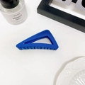 Minimalist blue matte triangular hair claw clip displayed on a clean aesthetic background - Navy Blue