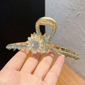 Detailed close-up of a sunflower hair claw with white petals and sparkling rhinestones - K99 White Sunflower