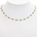 Golden stainless steel necklace featuring a sequence of light blue daisy flower pendants - Gold + Lake Blue