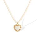 Elegante gouden hartvormige hanger met parels en een schitterende kristallen rand - Hartstijl (XL150) / XL150 Witte Schelp Gouden Ketting