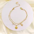 Detail of 18k gold plated stainless steel anklet with starfish shell and zircon pendants - Double Layer Starfish Shell / Gold