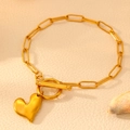 Detail of 18k gold plated stainless steel paperclip chain bracelet with heart charm and OT buckle - Bracelet / Gold