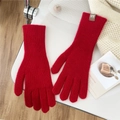 Winter red knitted wool gloves with ribbed texture and minimalist brown brand tag on white surface - One Size / Red