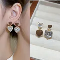 Detail of double heart earrings with brown enamel and white zircon on a jewelry box - 19# Silver Needle Gold Coffee Heart Zircon Pendant