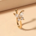 Golden butterfly non-piercing nose clip with clear cubic zirconia on beige surface - Butterfly Style (A-1204)