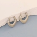 Silver stainless steel heart hoop earrings with textured finish on a white stone base - Silver Style K7-9