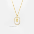 Detailed macro view of 18K gold S925 silver necklace with oval frame and pavé letter H pendant - Letter H