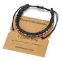 Detail of black woven leather Morse code bracelet with silver beads on a handmade gift card - I Love You