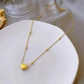 Minimalist 18K gold heart pendant necklace with bead chain on white display plate - Beaded Chain Heart Necklace (873 Beaded Peach Necklace)