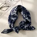 Detail shot of navy blue floral cotton linen scarf with vintage pattern and glasses - XY-22 Navy White Floral