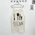 Detail of off-white canvas kitchen apron featuring cutlery graphics and H-shaped straps - KITCHEN White