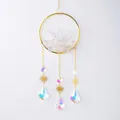 Bohemian gold sun catcher with white natural crystal cluster and rainbow prisms - Round Wind Chime Made Of White Crystal And Boulders