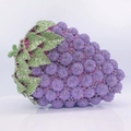 Grape shaped evening clutch bag with purple crystals and green metal leaves on white background - Violet