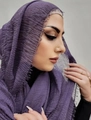 Purple crinkle cotton linen scarf with frayed edges worn by a model in a studio - Purple