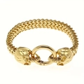 Close-up of golden Viking skull bracelet with franco link chain and circular ring clasp - 21cm / Gold Skull