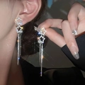 Elegant silver star tassel earrings with white zircon crystals in a long dangle style - Star Rhinestone Tassel / Silver