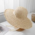 Close-up of raffia straw sun hat featuring a delicate white lace ribbon and frayed brim - M (56-58cm) / Coarse Raffia Plain