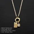 Gold-plated stainless steel necklace with CZ pendant and 'U' initial letter tag - Letter U (XNL0116)