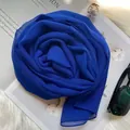 Detailed texture of blue silk chiffon scarf styled with elegant fashion accessories - Blue / 160x50cm
